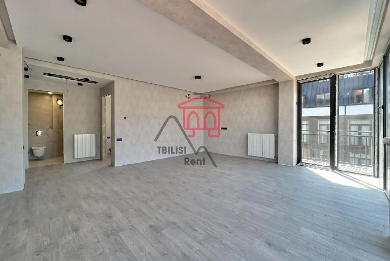 A bright apartment is for sale in a new building in the center of Saburtalo. The apartment has undergone full renovation and features three high-quality air conditioning systems throughout, two bathrooms, and panoramic windows. The owner will install interior doors. The apartment is almost completely ready to move in. — фото 4