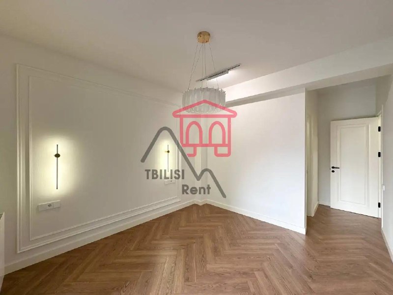 A spacious, newly renovated, unfurnished apartment in a new building on the Nutsubidze Plateau is for sale. It features a living room, two bedrooms, a walk-in closet, two bathrooms, and a spacious balcony. It features German laminate flooring and Italian heating. — фото 5
